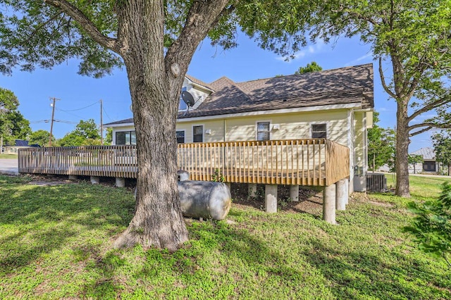 3701 Fm 972, Georgetown, TX 78626 - rear view of property featuring a wooden deck and a lawn