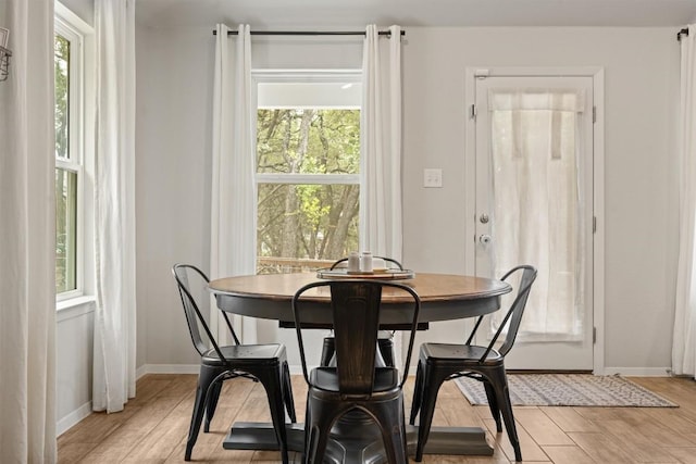1703 Omaha Dr, Lago Vista, TX 78645 - dining area with plenty of natural light and light wood-style flooring
