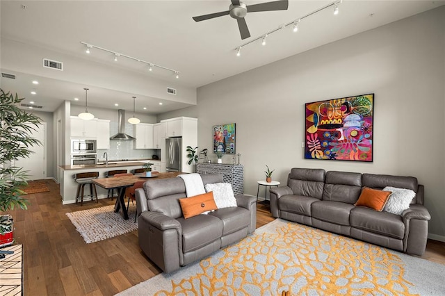 5921 Hiline Rd Unit 2404, Austin, TX 78734 - living area with track lighting, a ceiling fan, wood finished floors, and recessed lighting