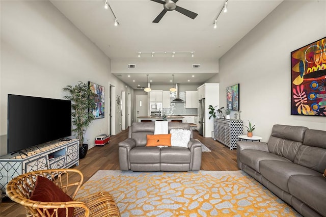 5921 Hiline Rd Unit 2404, Austin, TX 78734 - living area featuring track lighting, ceiling fan, and dark wood-type flooring