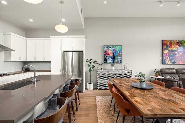 5921 Hiline Rd Unit 2404, Austin, TX 78734 - dining space with light wood-style floors and recessed lighting