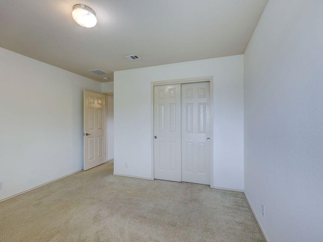 11509 Timber Heights Dr, Austin, TX 78754 - unfurnished bedroom featuring light carpet and a closet