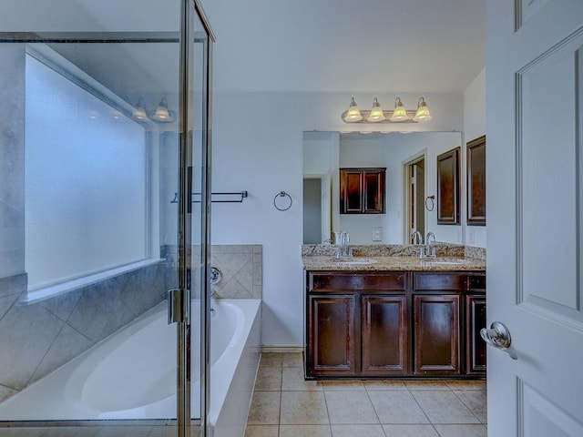 11509 Timber Heights Dr, Austin, TX 78754 - bathroom with a garden tub, double vanity, tile patterned floors, and a shower with door