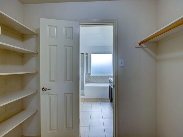 11509 Timber Heights Dr, Austin, TX 78754 - spacious closet featuring light tile patterned floors