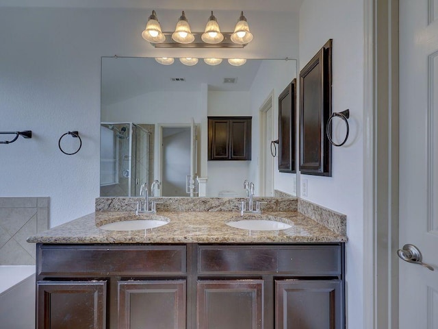 11509 Timber Heights Dr, Austin, TX 78754 - full bath featuring double vanity, a shower stall, and a tub