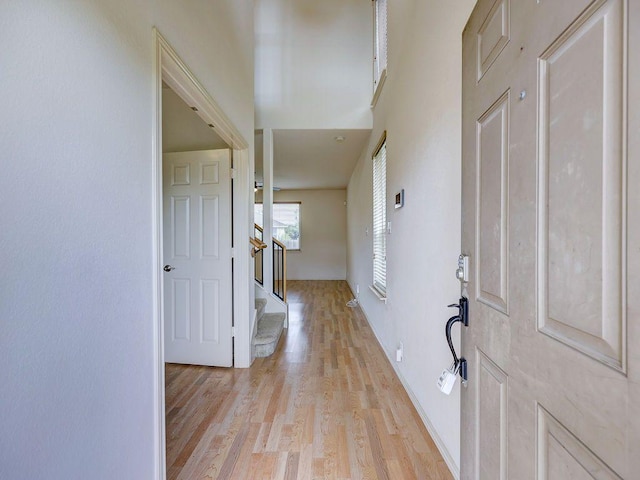 11509 Timber Heights Dr, Austin, TX 78754 - foyer entrance with light wood finished floors and stairs