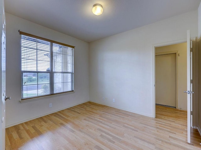 11509 Timber Heights Dr, Austin, TX 78754 - empty room with light wood-style flooring and baseboards