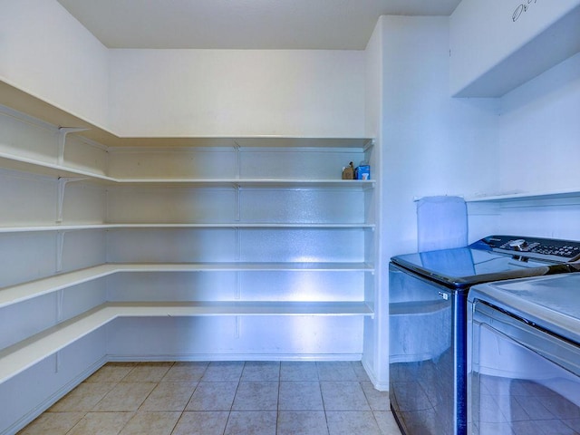 11509 Timber Heights Dr, Austin, TX 78754 - washroom with washer and dryer and light tile patterned flooring