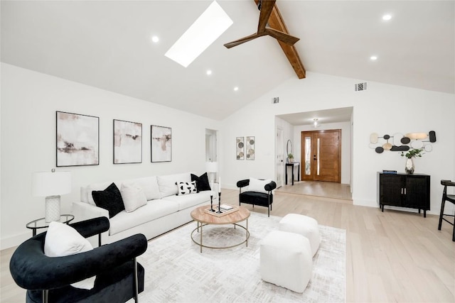12044 Lincolnshire Dr, Austin, TX 78758 - living room with a skylight, light wood finished floors, beamed ceiling, recessed lighting, and high vaulted ceiling