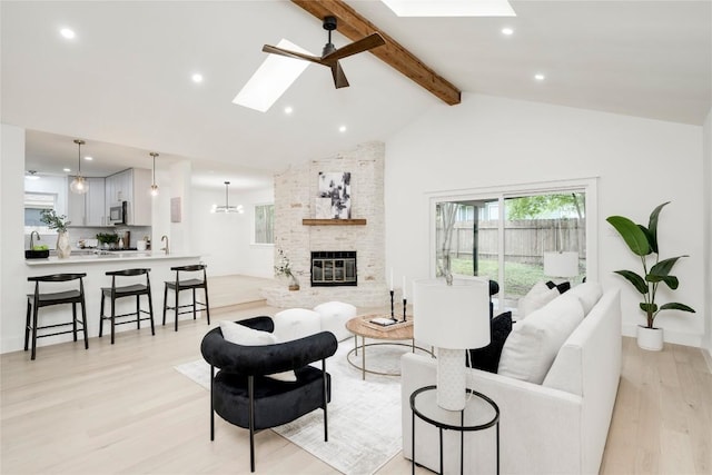 12044 Lincolnshire Dr, Austin, TX 78758 - living room featuring a skylight, beam ceiling, light wood-style flooring, recessed lighting, and high vaulted ceiling