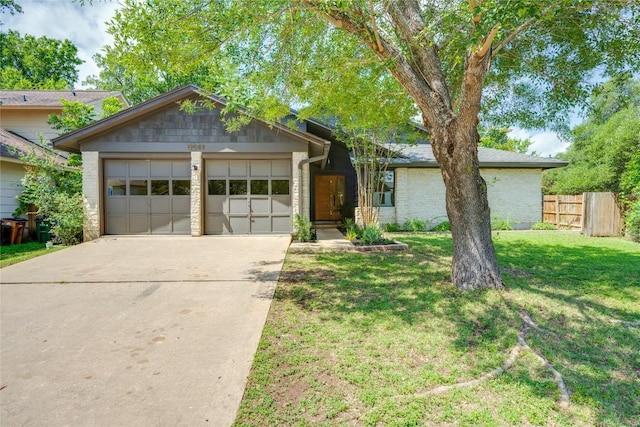 12044 Lincolnshire Dr, Austin, TX 78758 - view of front of house featuring a garage, driveway, and brick siding