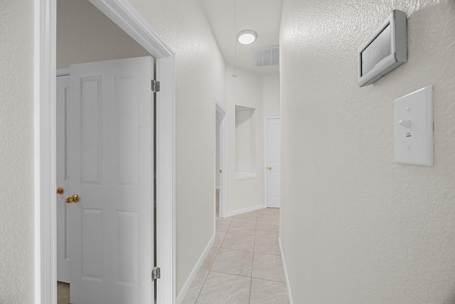 1500 Amelia Dr, Cedar Park, TX 78613 - hall featuring light tile patterned floors and baseboards