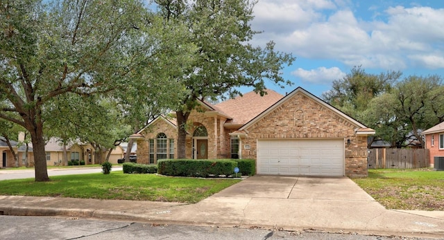 1500 Amelia Dr, Cedar Park, TX 78613 - view of front of property with brick siding, an attached garage, driveway, and roof with shingles