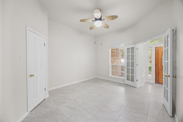 1500 Amelia Dr, Cedar Park, TX 78613 - spare room featuring french doors, a ceiling fan, and light tile patterned flooring