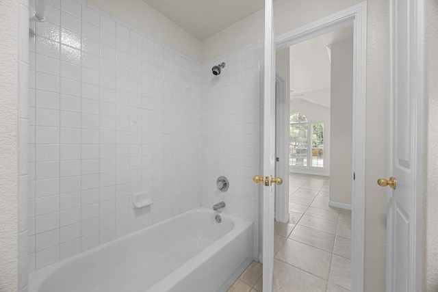 1500 Amelia Dr, Cedar Park, TX 78613 - bathroom featuring tile patterned floors, shower / bathtub combination, and lofted ceiling