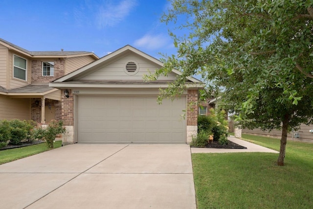 3305 Tilmon Ln, Austin, TX 78725 - view of front of property with brick siding, driveway, a garage, and a front yard