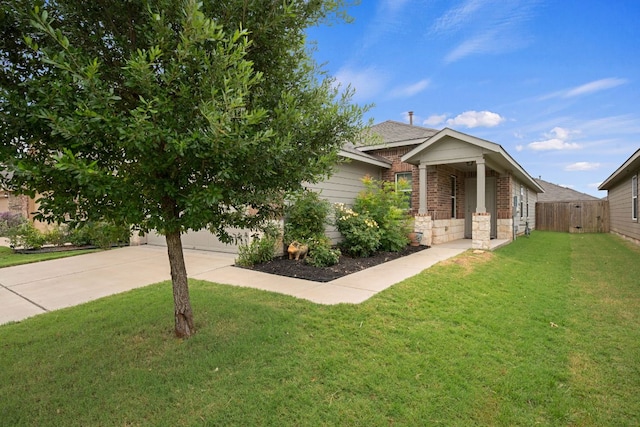 3305 Tilmon Ln, Austin, TX 78725 - view of front of home featuring driveway, a garage, and brick siding