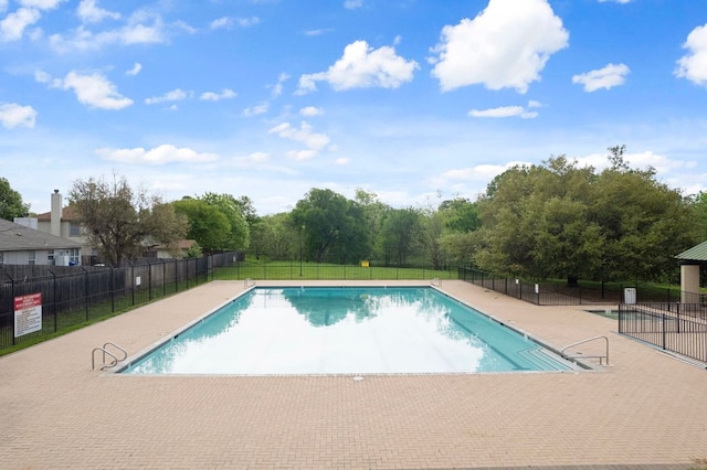 3305 Tilmon Ln, Austin, TX 78725 - community pool featuring a patio area