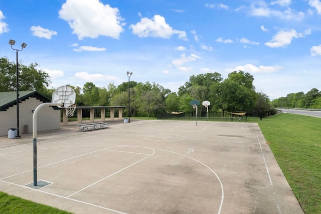 3305 Tilmon Ln, Austin, TX 78725 - view of basketball court with community basketball court, a lawn, and view of scattered trees