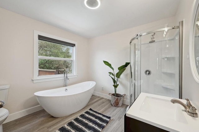 15507 NE Enid Dr, Austin, TX 78734 - full bath with a stall shower, wood finished floors, a soaking tub, and vanity