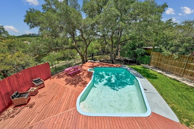 15507 NE Enid Dr, Austin, TX 78734 - view of pool with a wooden deck and a fenced backyard