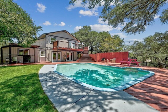 15507 NE Enid Dr, Austin, TX 78734 - view of swimming pool with french doors, stairs, a patio, and a wooden deck