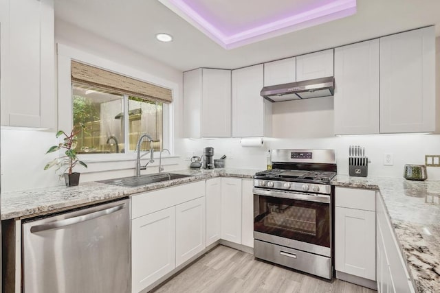 15507 NE Enid Dr, Austin, TX 78734 - kitchen featuring stainless steel appliances, under cabinet range hood, recessed lighting, and white cabinets