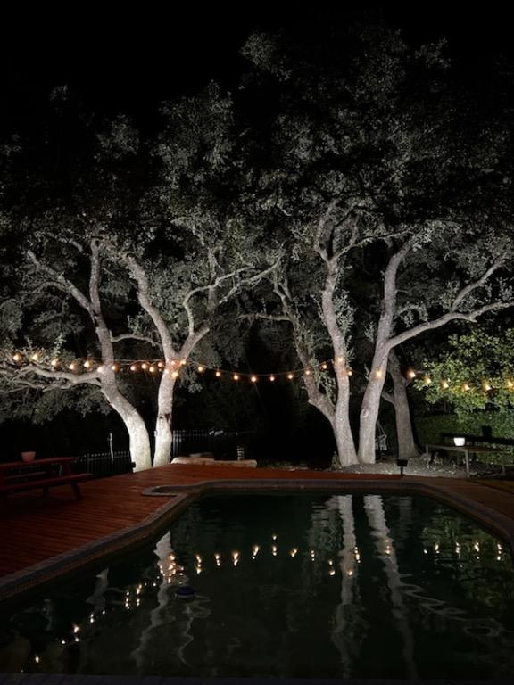 15507 Enid Dr, Austin, TX 78734 - pool at night with a deck