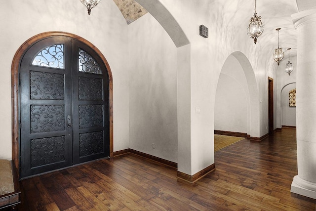 908 Watercliffe Dr, Lago Vista, TX 78645 - foyer with arched walkways, lofted ceiling, and hardwood / wood-style flooring