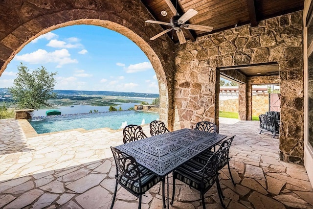 908 Watercliffe Dr, Lago Vista, TX 78645 - view of patio / terrace featuring ceiling fan, an infinity pool, and outdoor dining area