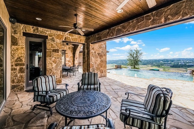 908 Watercliffe Dr, Lago Vista, TX 78645 - view of patio / terrace featuring ceiling fan and an outdoor pool