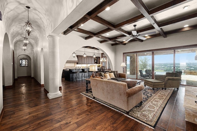 908 Watercliffe Dr, Lago Vista, TX 78645 - living area featuring arched walkways, ceiling fan, beam ceiling, dark wood finished floors, and coffered ceiling
