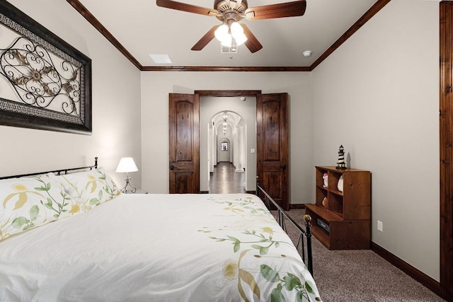 908 Watercliffe Dr, Lago Vista, TX 78645 - bedroom featuring carpet floors, ornamental molding, arched walkways, and a ceiling fan