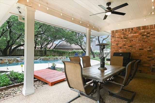 10309 Van Winkle Ct, Austin, TX 78739 - fenced backyard featuring a ceiling fan, outdoor dining space, a jacuzzi, and a patio area