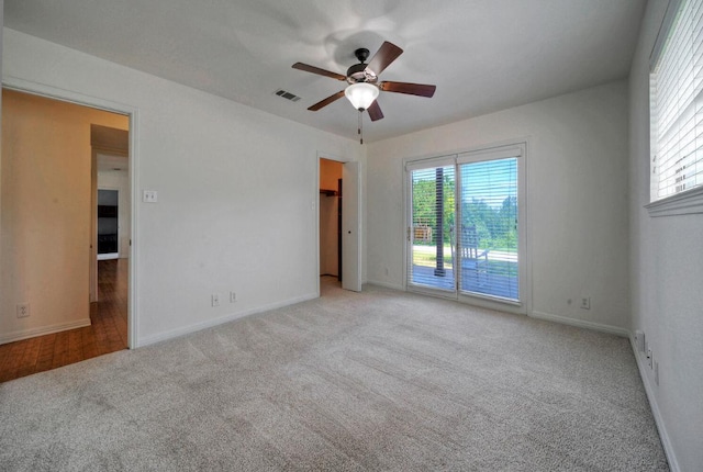 13111 Mansfield Dr, Austin, TX 78732 - carpeted spare room with ceiling fan and plenty of natural light