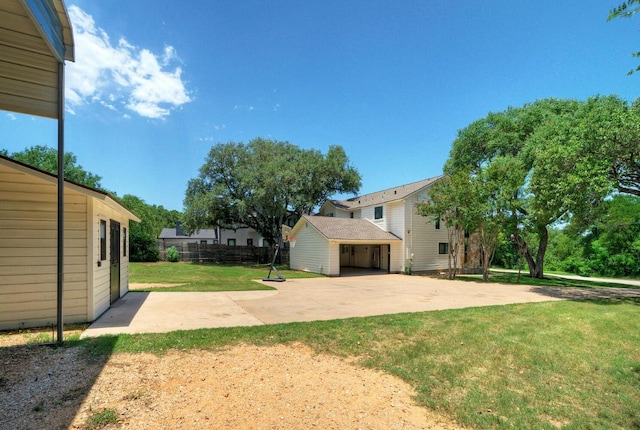 13111 Mansfield Dr, Austin, TX 78732 - view of yard with an outbuilding