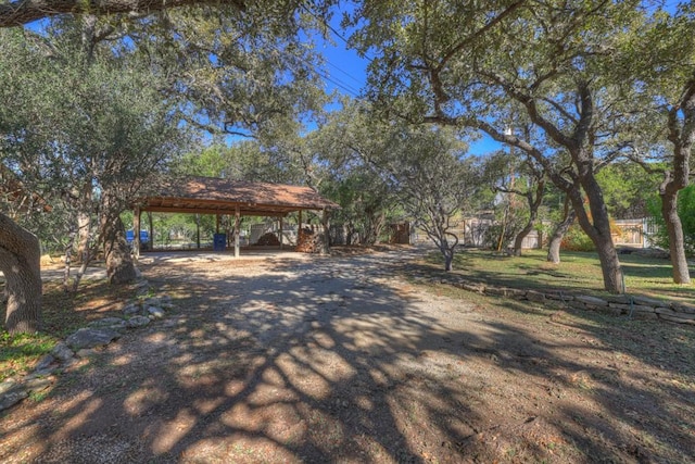 642 Lakebreeze Dr, Canyon Lake, TX 78133 - view of yard with asphalt driveway and a carport