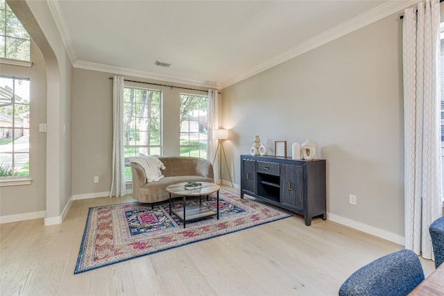 4105 Canyon Glen Cir, Austin, TX 78732 - living area featuring wood finished floors, crown molding, healthy amount of natural light, and arched walkways