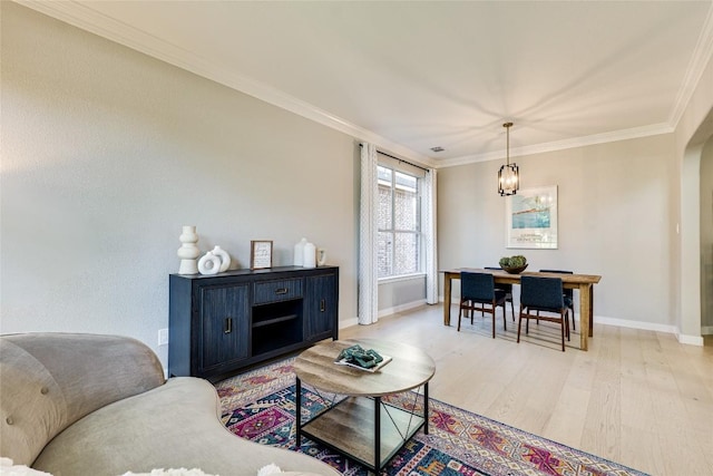 4105 Canyon Glen Cir, Austin, TX 78732 - living room featuring light wood-style floors, ornamental molding, and arched walkways