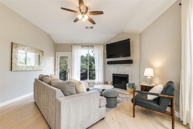 4105 Canyon Glen Cir, Austin, TX 78732 - living room with vaulted ceiling, light wood-type flooring, a ceiling fan, and a fireplace