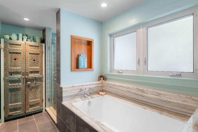 2606 Rockingham Dr, Austin, TX 78704 - full bathroom with tile patterned flooring, a stall shower, a bath, and recessed lighting