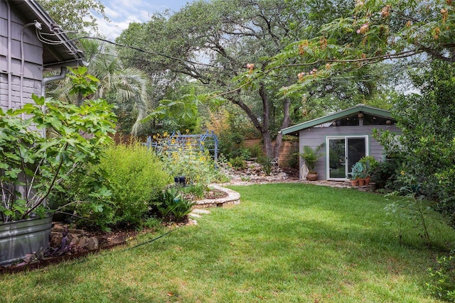 2606 Rockingham Dr, Austin, TX 78704 - view of grassy yard with an outbuilding