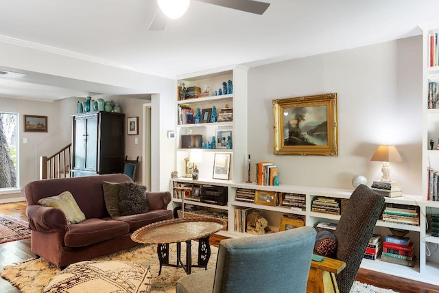 2606 Rockingham Dr, Austin, TX 78704 - living area featuring wood finished floors, a ceiling fan, ornamental molding, and stairway