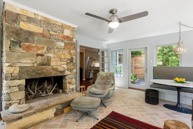 2606 Rockingham Dr, Austin, TX 78704 - living area featuring ceiling fan and a fireplace