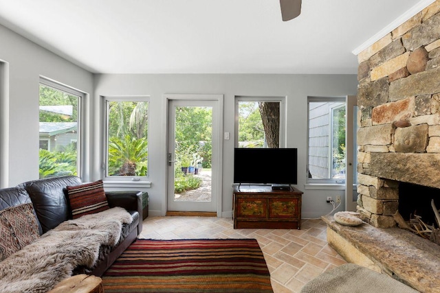 2606 Rockingham Dr, Austin, TX 78704 - living area featuring plenty of natural light, light stone finish floors, and ceiling fan