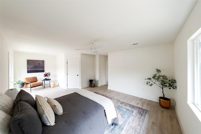 5731 Wellington Dr, Austin, TX 78723 - bedroom with light wood-type flooring and ceiling fan