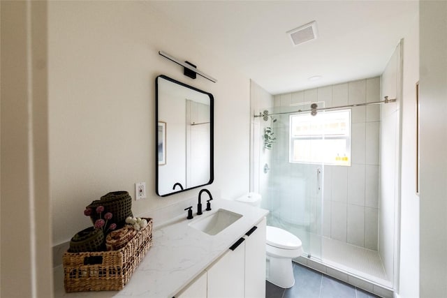 5731 Wellington Dr, Austin, TX 78723 - full bathroom featuring vanity, a stall shower, and tile patterned floors