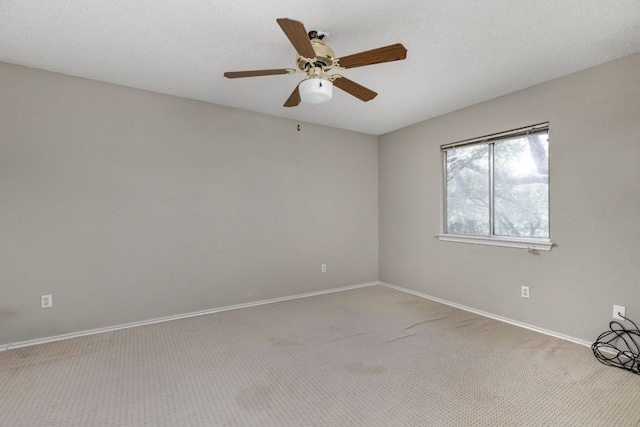 11978 Dorsett Rd, Austin, TX 78727 - carpeted spare room with baseboards and a ceiling fan
