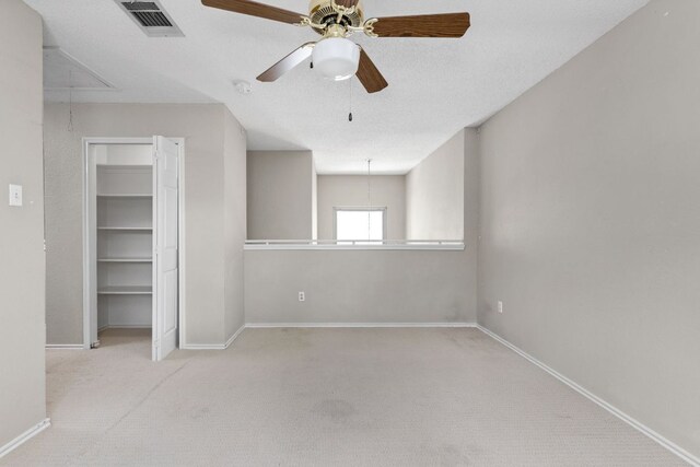 11978 Dorsett Rd, Austin, TX 78727 - unfurnished bedroom featuring attic access, carpet, a ceiling fan, and a closet