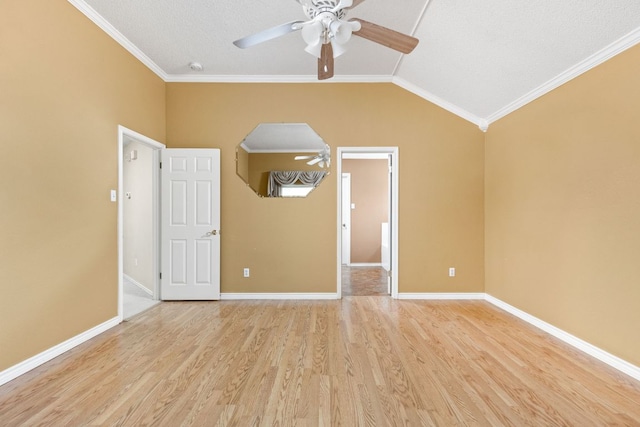 11978 Dorsett Rd, Austin, TX 78727 - spare room with ceiling fan, light wood-style floors, crown molding, lofted ceiling, and a smoke detector